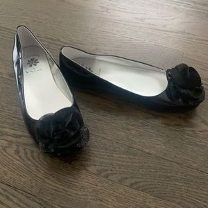 Black patent flats with flower